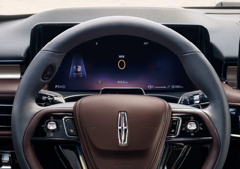 The steering wheel of 2025 Lincoln Aviator® SUV is shown with black and brown accents. | Johnson Brothers Lincoln in Temple TX