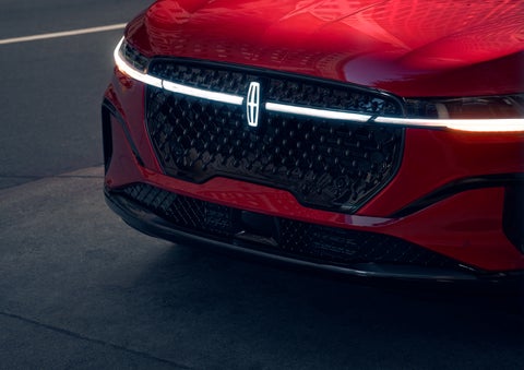 The available front LED light bar and center Lincoln Star logo glow at dusk. | Johnson Brothers Lincoln in Temple TX