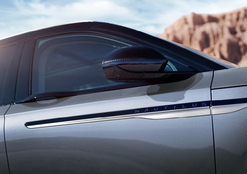 Blue lettering on the side of the vehicle that reads nautilus indicates the available hybrid powertrain. | Johnson Brothers Lincoln in Temple TX