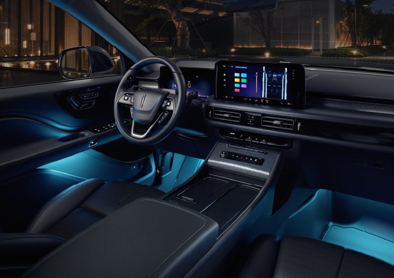 Deep blue ambient lighting glows from various places within a 2026 Lincoln Aviator® SUV. | Johnson Brothers Lincoln in Temple TX