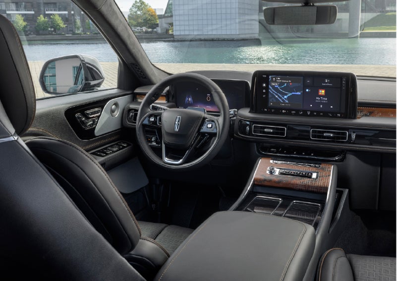 The interior of the 2026 Lincoln Aviator® SUV is shown parked with a view of a harbor through the windshield. | Johnson Brothers Lincoln in Temple TX