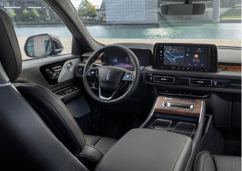 The interior of the 2026 Lincoln Aviator® SUV is shown parked with a view of a harbor through the windshield. | Johnson Brothers Lincoln in Temple TX