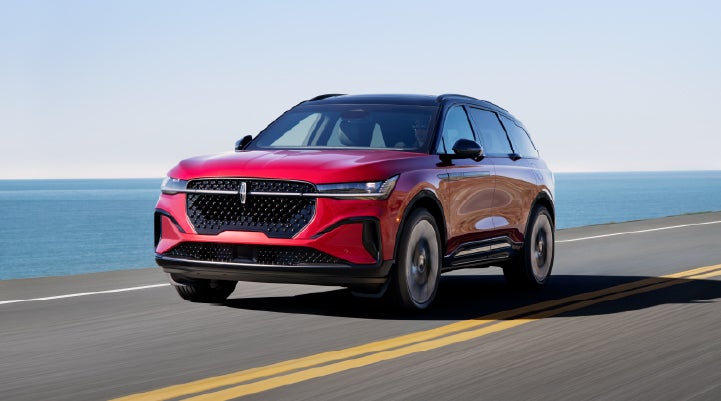 A 2026 Lincoln Nautilus® SUV is being driven on a seaside roadway. | Johnson Brothers Lincoln in Temple TX