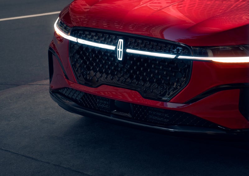 The available front LED light bar and center Lincoln Star logo glow at dusk. | Johnson Brothers Lincoln in Temple TX