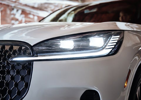 A close-up of a headlamp on the 2027 Lincoln Aviator® SUV is shown. | Johnson Brothers Lincoln in Temple TX