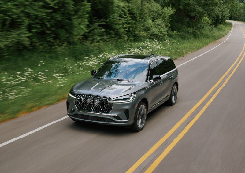 A 2027 Lincoln Aviator® SUV is being driven down a road. | Johnson Brothers Lincoln in Temple TX