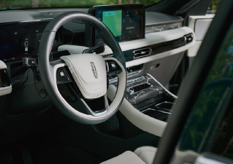 The leather-trimmed steering wheel of a 2027 Lincoln Aviator® Black Label™ SUV. | Johnson Brothers Lincoln in Temple TX