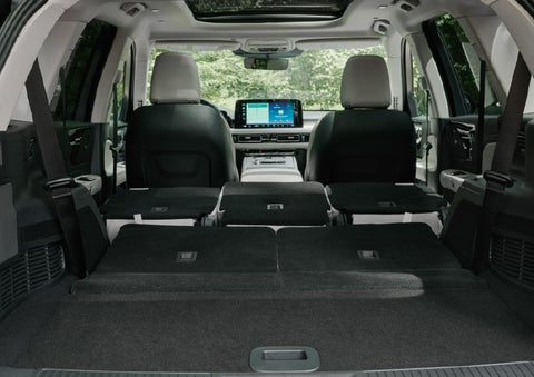 A rear to front view of the interior of a 2027 Lincoln Aviator® Black Label™ SUV shows the third and second rows folded flat | Johnson Brothers Lincoln in Temple TX